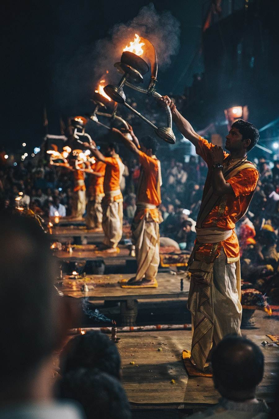 Ganga aarti ceremony at Dashashwamedh Ghat in Varanasi with priests holding fire lamps